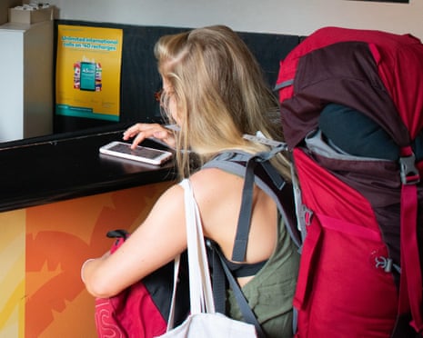 A backpacker checks into a hostel in Melbourne