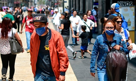 People wear face masks to combat air pollution in Mexico City