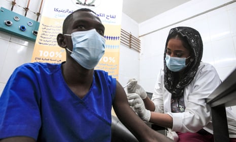 A medical worker receives a dose of coronavirus vaccine at a hospital in Khartoum, Sudan, on March 9, 2021.