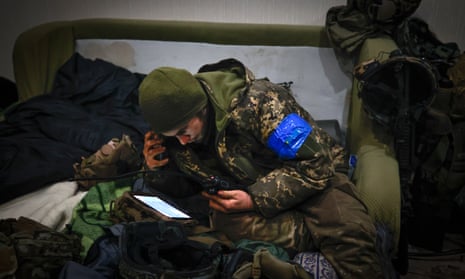 A Ukrainian officer examines the situation in a shelter in Soledar, the site of heavy battles with Russian forces in the Donetsk region, Ukraine.