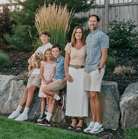 Parents Kelly and Devin McNeil with children (from left) Talon, Londyn and Paxton, standing in a garden