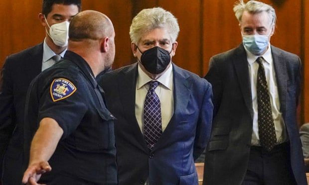 Glenn Horowitz, centre, alongside Craig Inciardi, right, appear in criminal court after being indicted for conspiracy involving handwritten notes for the Eagles album Hotel California.