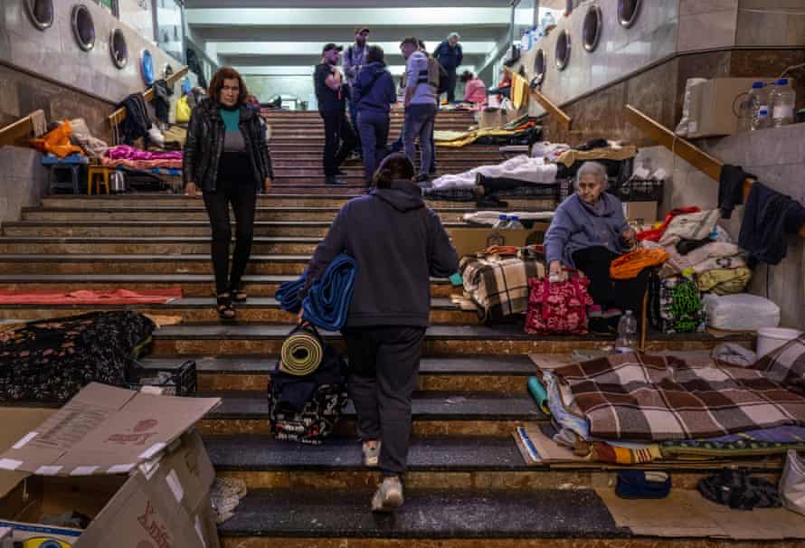 Kharkiv resident Tatiana, who has been living in an underground metro station for more than two months, packs her belongings to move home.