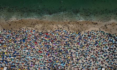 People visit Ipanema beach in Rio de Janeiro amid the heat.