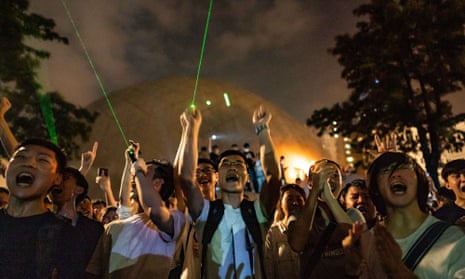 Protesters use laser pointers during a demonstration in Hong Kong.