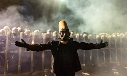 A protester wearing a whirling dervish costume performs in front of Turkish riot police barricades as he tries to march to Taksim Square from the Istanbul Municipality headquarters during a protest against the detention of Istanbul Mayor Ekrem Imamoğlu in Istanbul.