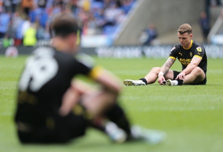Wigan’s Max Power looks dejected after relegation from the Championship is confirmed