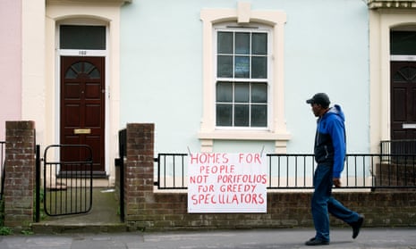 A man walks past a flat up for auction on City Road in St Paul’s, Bristol.