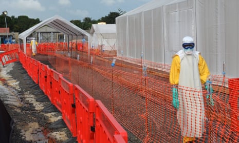 Health workers at an Ebola treatment centre run in Monrovia