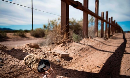 The US-Mexico border fence outside Lukeville, Arizona. Volunteers are said to have found hundreds of water gallons vandalised in a patch of Sonoran desert.