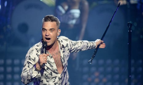 Robbie Williams performing live