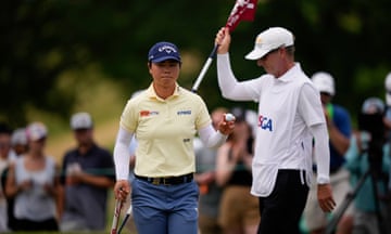 Yuka Saso, of Japan, walks on the first green during the final round of the U.S. Women's Open.