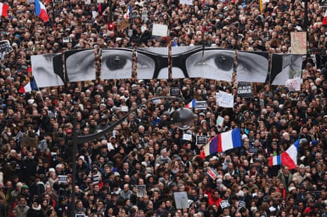 Demonstrators make their way along Boulevrd Voltaire in a unity rally in Paris following the Charlie Hebdo terrorist attacks on January 11, 2015 in Paris, France