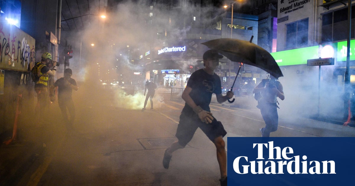 Hong Kong: Clashes as first charges brought under face mask ban law
