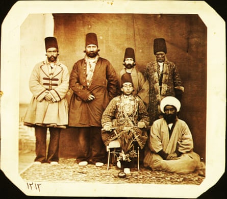 Muzaffar al-Din Mirza (Muzaffar al-Din Shah Qajar 1853-1907) accompanied by his entourage. Prince Muzaffar Mirza’s high-ranking African slave (khajeh) is standing on his right, possibly in Tabriz, Iran, 1880s.