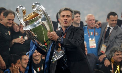 Inter’s manager Jose Mourinho holds the trophy following their 2010 Champions League final victory against Bayern Munich in Madrid