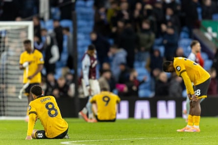 Wolves players are left dejected at Villa Park