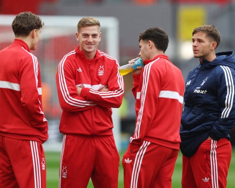 Nottingham Forest's James McAtee and Liam Delap with teammates inside Anfield before the match.