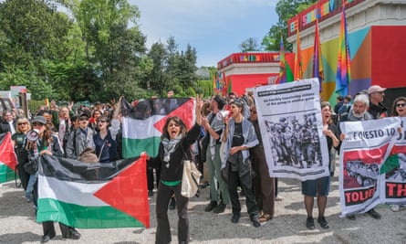 Protesters wave Palestinian flags near the Israeli pavilion at the Venice Biennale in the Giardini.