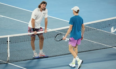Tsitsipas prepares to shake hands with Sinner at the end of their five-set encounter.