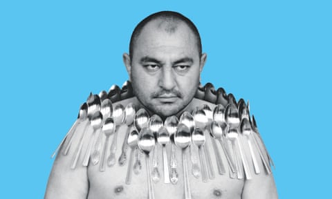 Etibar Elchiyev attempts to break the Guinness World Record for most spoons on a human body, in Tbilisi, Georgia in 2011.