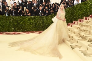 The ever ethereal Kate Bosworth called on Oscar de la Renta’s designers Laura Kim and Fernando Garcia for her custom white gown, topped with a mantilla veil. The designers also worked with her on her wedding gown when she wed Michael Polish in 2013