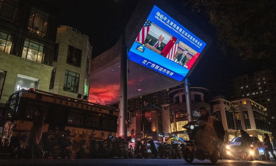 A screen in a Beijing street shows Xi Jinping and Joe Biden in talks via videolink last November