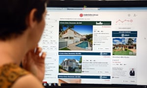 A woman looks at real estate advertising on an internet website in Brisbane, 6 January 2014