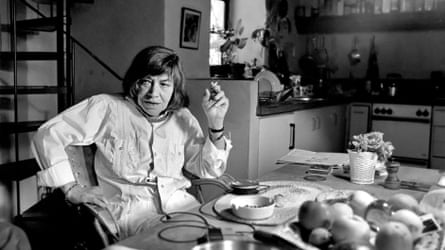Black and white photo of Patricia Highsmith at home