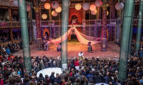 Groundlings enjoy a close-up view of the action on stage in a production of A Midsummer Night’s Dream at Shakespeare's Globe.