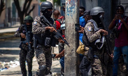 Haitian national police patrol in the Champs de Mars, the main public square of Port-au-Prince