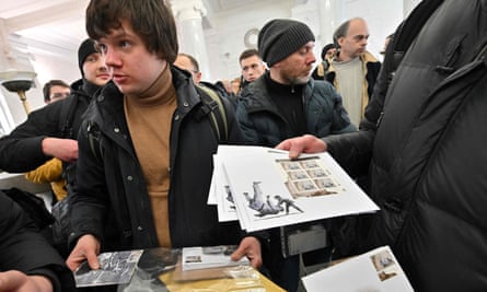 People buying first-day issue Banksy stamps at the main post office in Kyiv