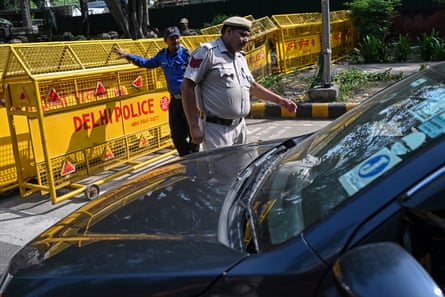 Delhi police inspect vehicles near the Jantar Mantar protest site in Delhi on Tuesday.