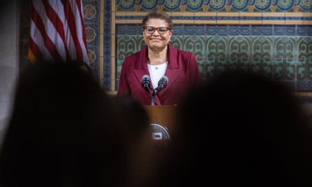 bass smiles behind podium