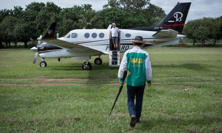 One of the sons of Ronaldo Rodrigues da Cunha, entering their private plane before living the farm. The boys are the fourth generation of farmers in their family.