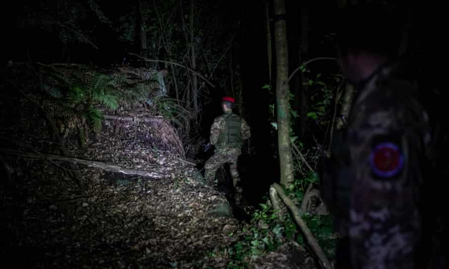 The elite Cacciatori unit during a night mission in the Calabrian mountains.