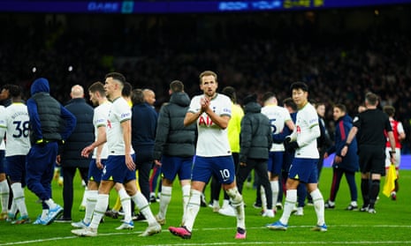 Harry Kane applauds the Spurs fans as his team trudge off at full-time after defeat by Arsenal.