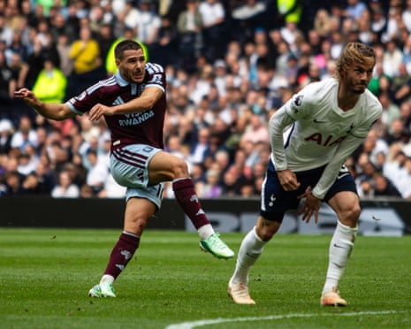 Aston Villa's Emi BuendÃÂa watches his shot, alongside Micky van de Ven of Tottenham