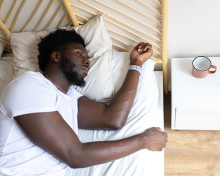 Young man sleeping peacefully in bed