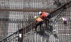 Construction workers are seen working at the Roma Street Station on the Cross River Rail project in Brisbane, Saturday, February 12, 2022. Over 200 people are currently working on the Cross River Rails Roma Street site and more than 2,000 working on the Cross River Rail project in total, 46,000 commuters are expected to use the new Roma Street station each weekday by 2036. (AAP Image/Darren England) NO ARCHIVING