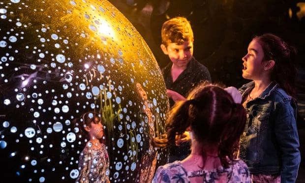 Children interact with The Spheres.