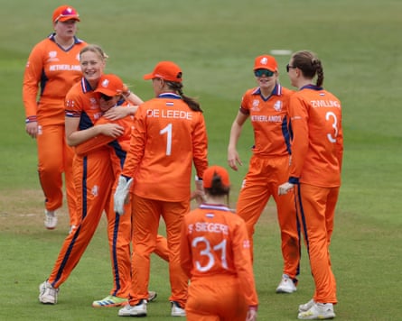 Several Netherlands cricketers, including captain Babette de Leede, celebrate a wicket during their Women’s T20 World Cup warm-up game against Scotland in Derby.