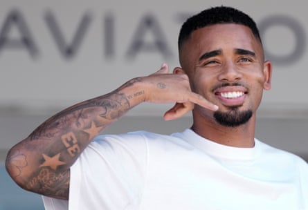 Gabriel Jesus gestures upon arrival at the airport in Barcelona