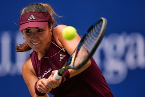 Camila Osorio of Colombia returns the ball to Aryna Sabalenka of Belarus.