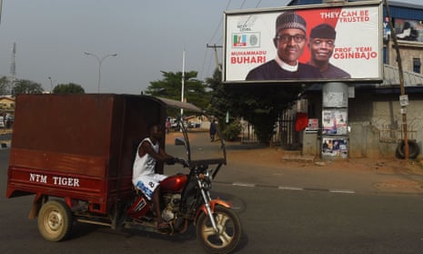 In Abuja the faces of president Mohammadu Buhari and vice-president Yemi Osinbajo stare down from a billboard as Nigeria prepared for general elections in February 2019.
