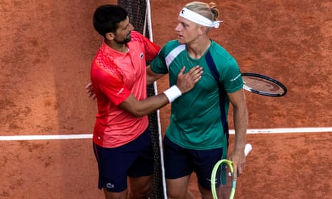 Novak Djokovic is congratulated by Spain's Alejandro Davidovich Fokina, right, after he won the third round match of the French Open tennis