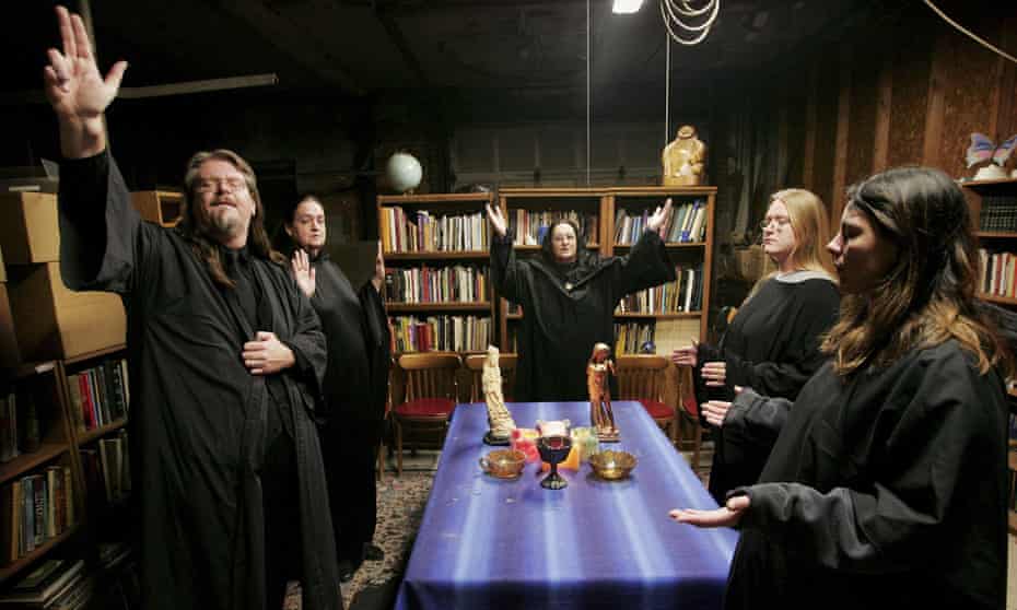 Wicca religion practitioners (l-r) Don Lewis, Krystal High-Correll, and Virgina Powell and student Ashleigh Powell and Cathy Smith participate in a Wiccan Lunar ritual in the temple at the Witch School in Hoopeston, Illinois.