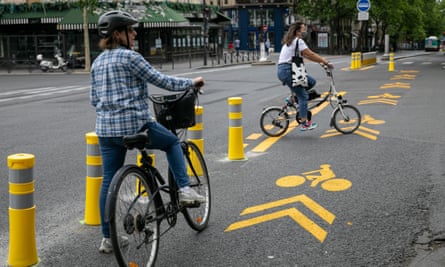 Temporary yellow markings for Paris’s new cycle lanes laid out during lockdown