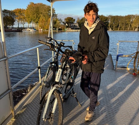 Rhiannon’s son with his rented e-bike on a ferry in Freisland