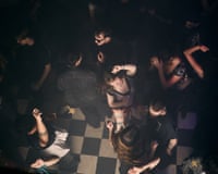Young people dance in a club